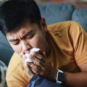 A person coughing with the flu.