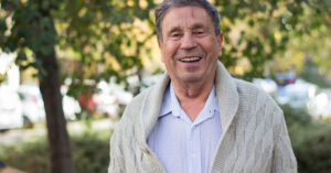 A smiling older man.