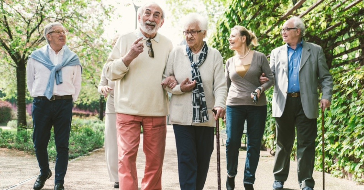 Older adults walking in a park.