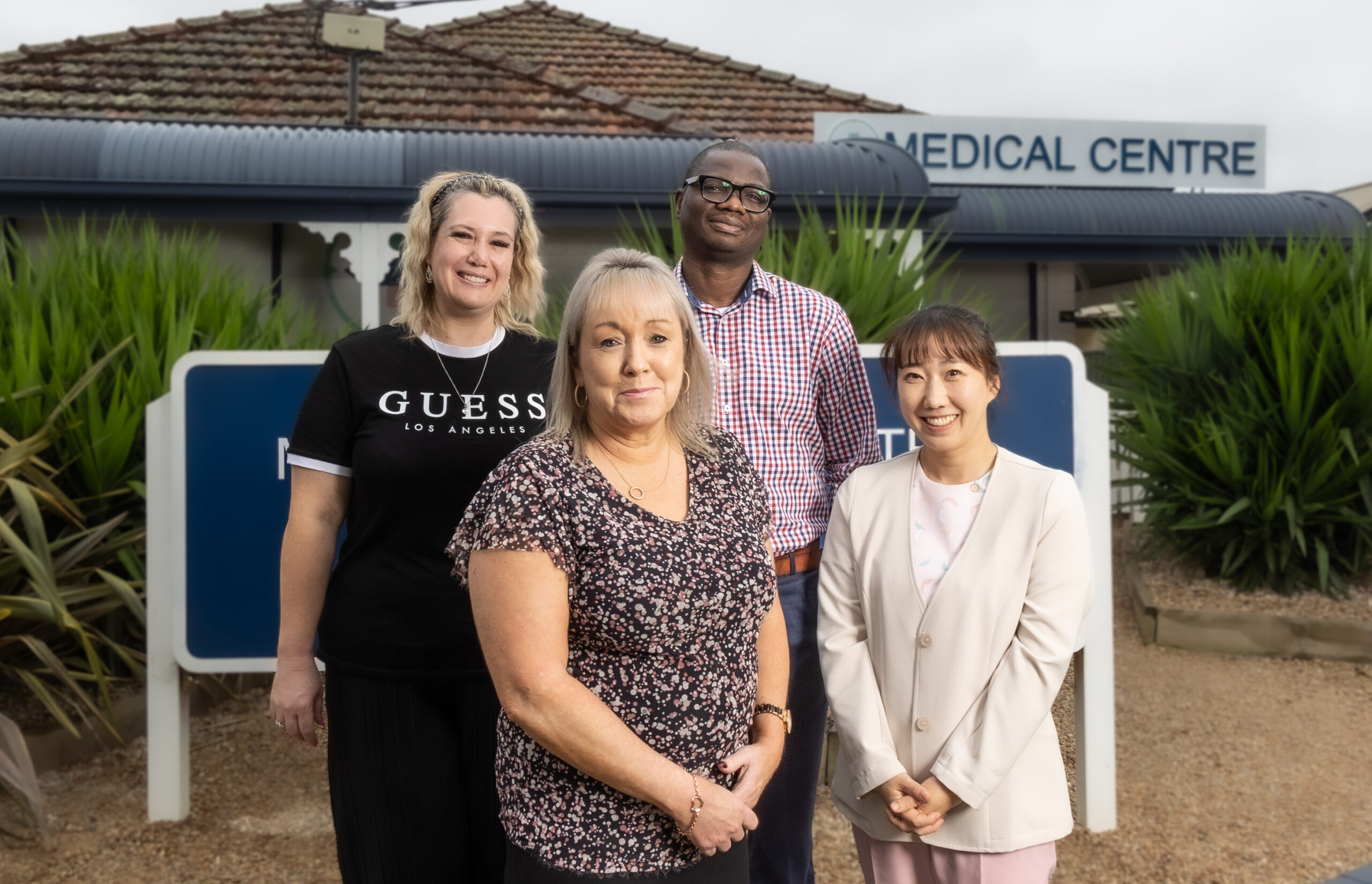 Donna Carver, Tracey Webb, Lauren Hwang and Dr Michael Oladiran outside Westview Medical Centre.