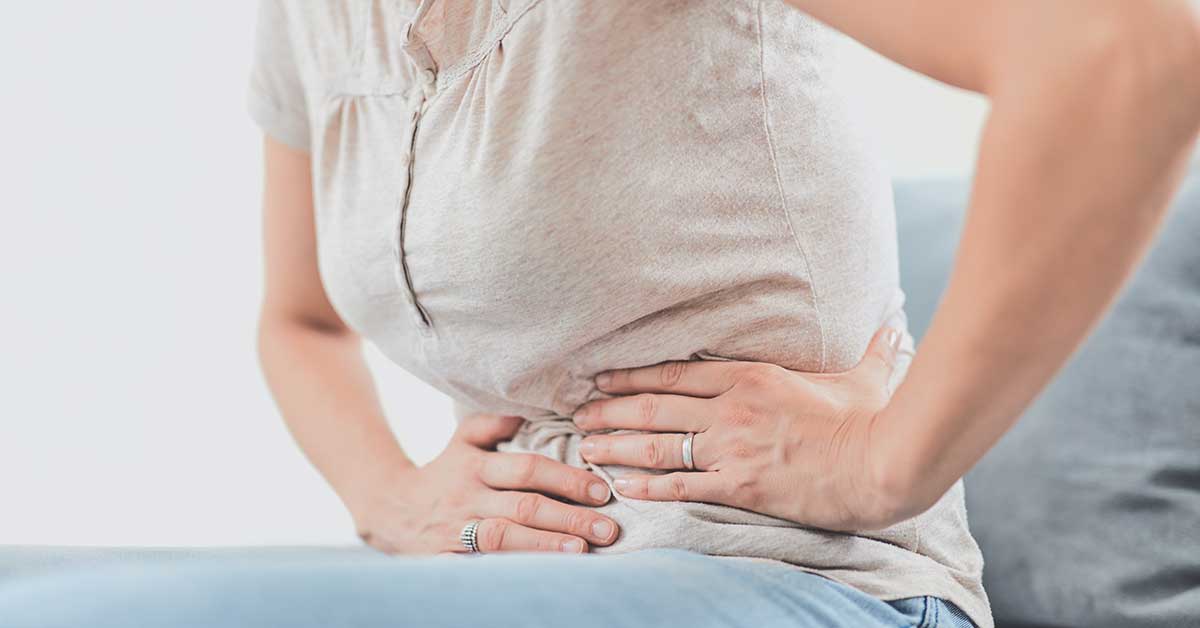 Woman suffering from heavy menstrual bleeding