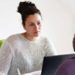 A health professional speaks with a person experiencing family violence