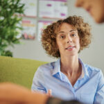 A female GP speaks with a female patient about Attention-deficit/hyperactivity disorder (ADHD)