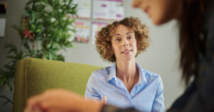 A female GP speaks with a female patient about Attention-deficit/hyperactivity disorder (ADHD)